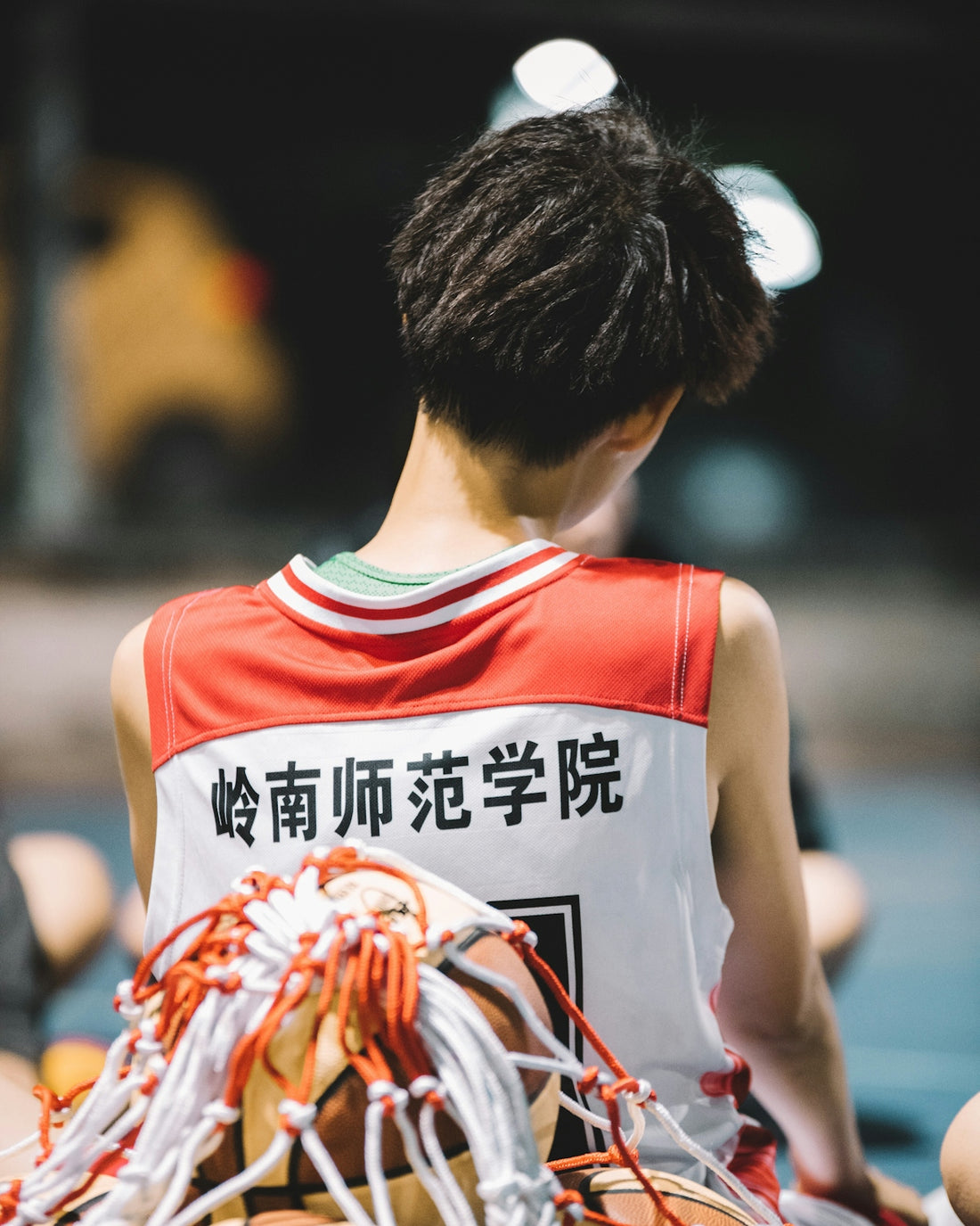 person wearing red and white jersey