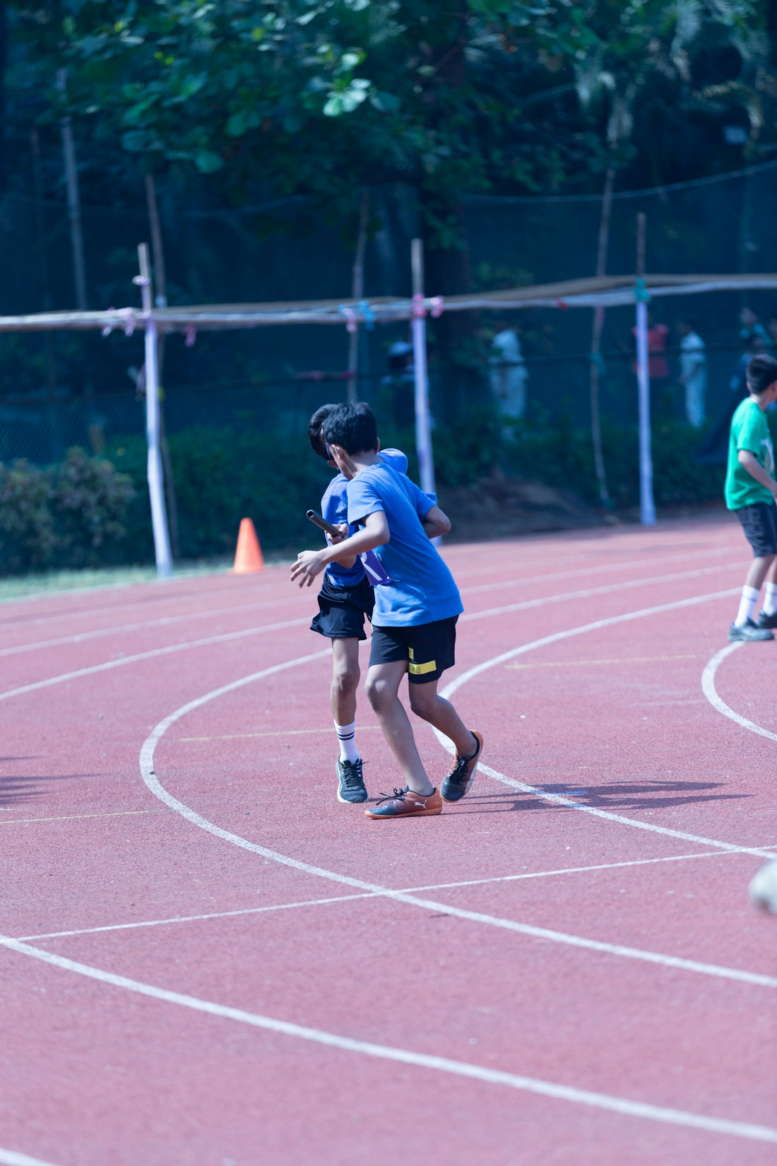 a group of young people playing a game of frisbee