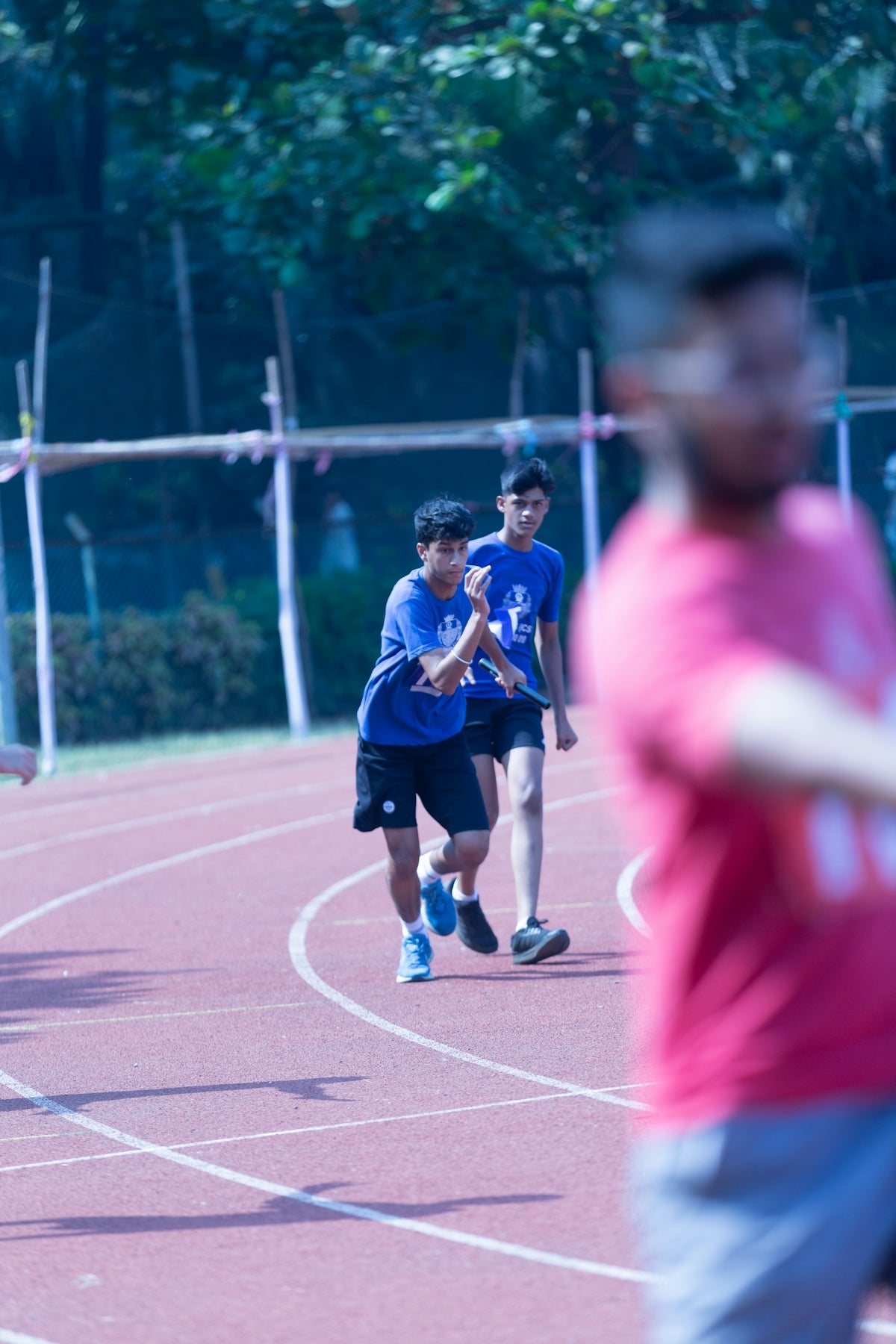 a group of young men playing a game of frisbee