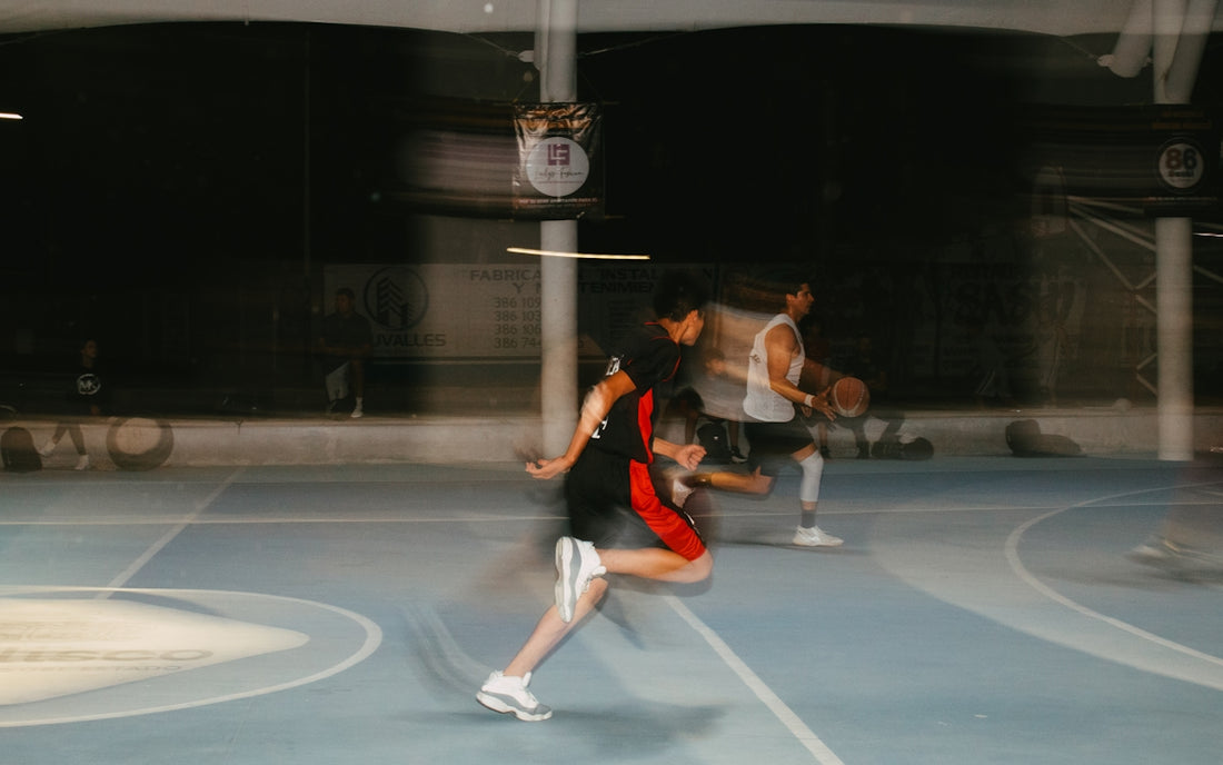 A group of people playing a game of tennis