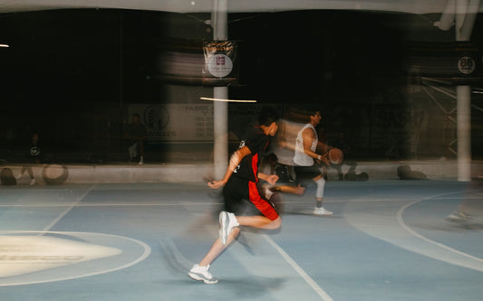 A group of people playing a game of tennis