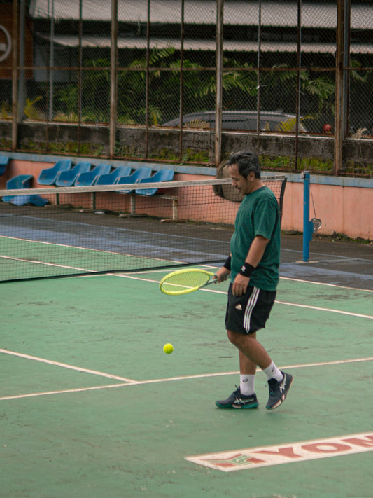 Man playing tennis on a court