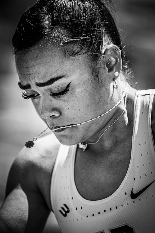 Athlete with necklace and focused expression